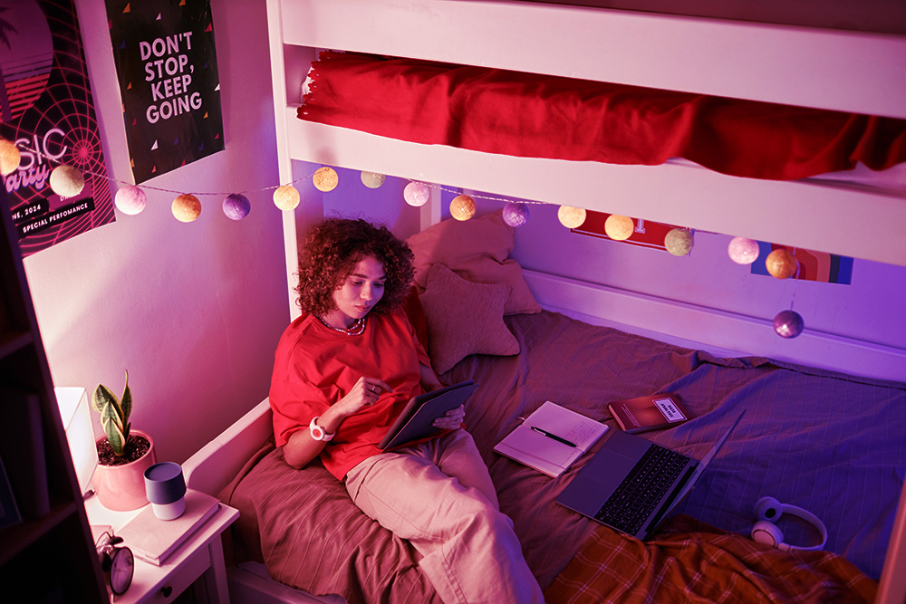 A student reading in their room