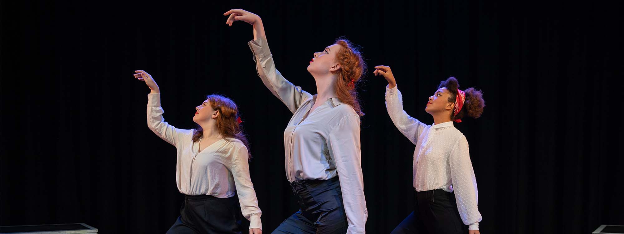 Three female students dancing