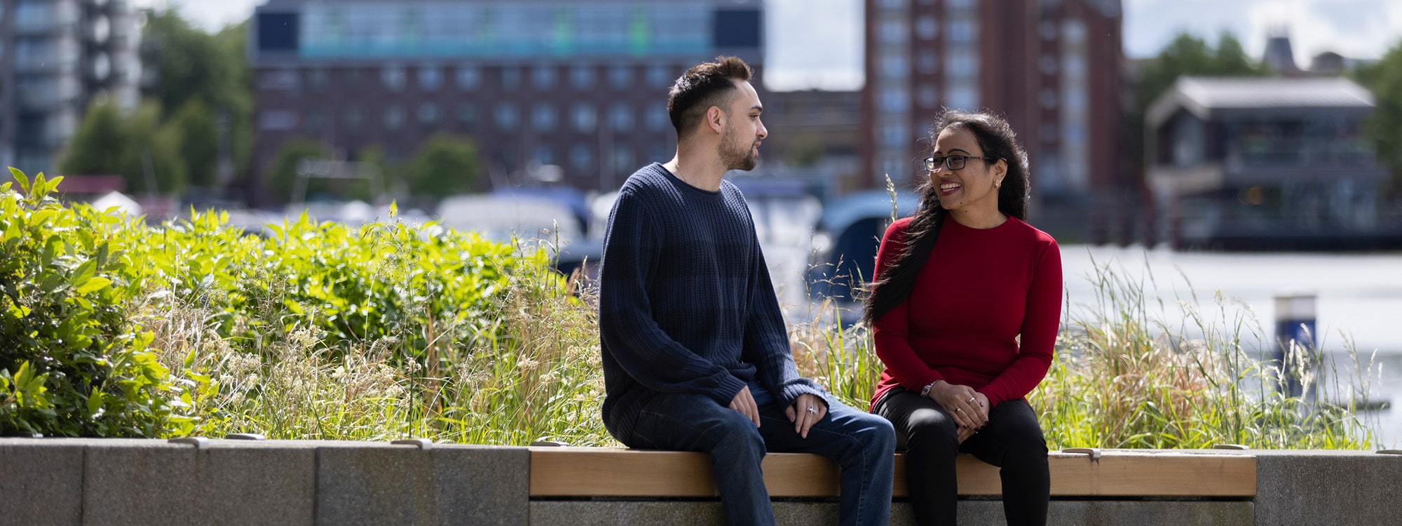Two students chatting by the waterfront